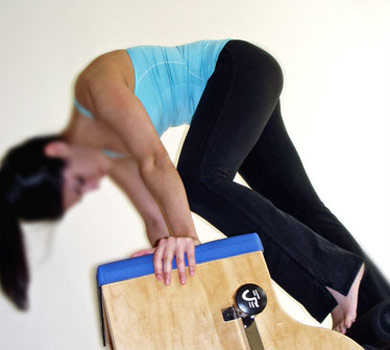Pilates exercise on combo chair